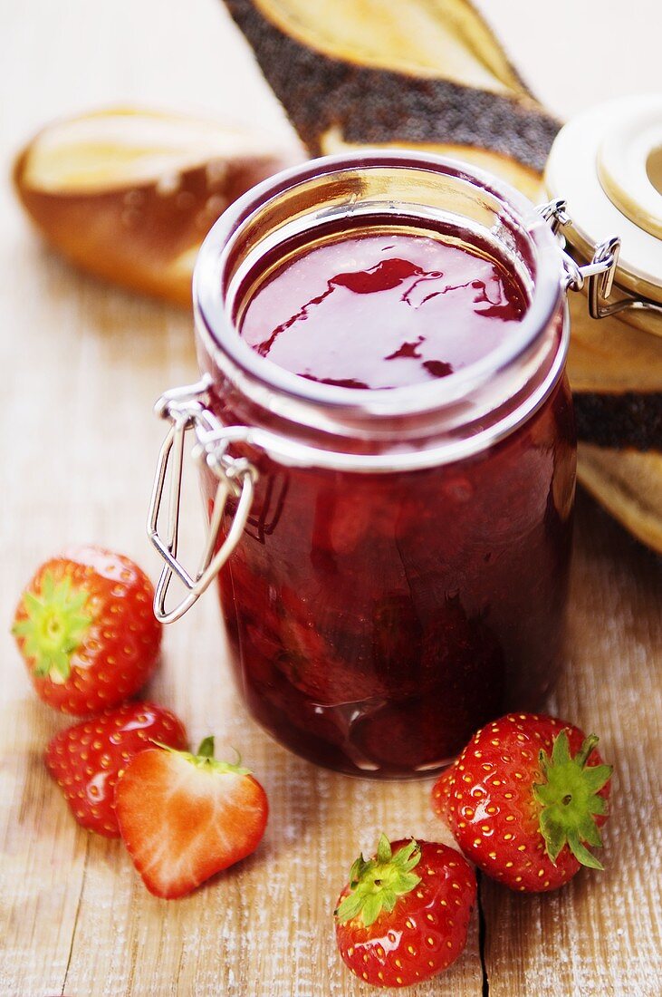 Strawberry jam, fresh strawberries and pretzel rolls