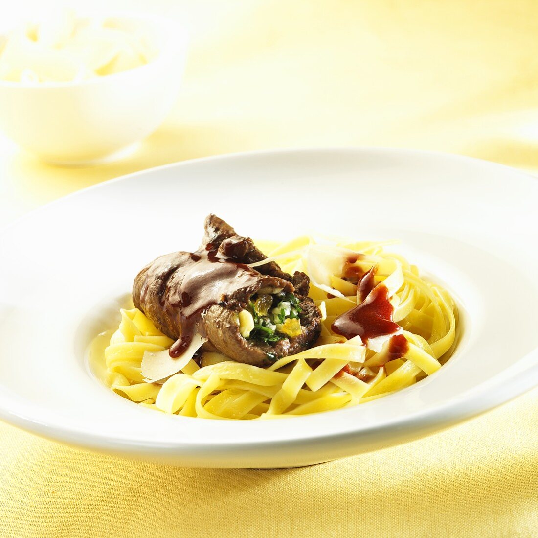 Beef roulade with red wine sauce and ribbon pasta