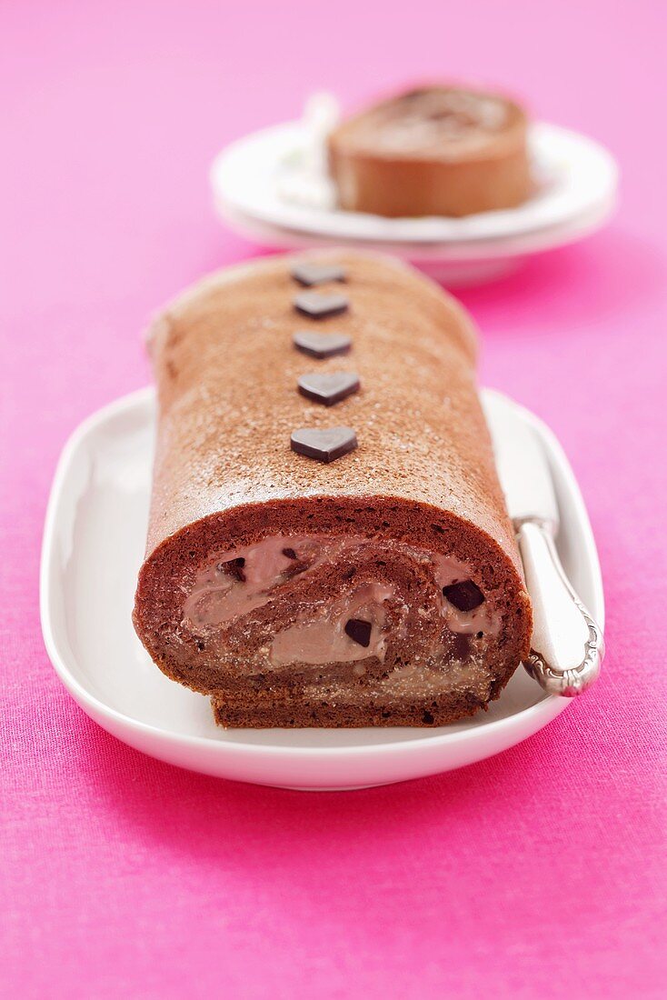 Chocolate sponge roll with chocolate hearts