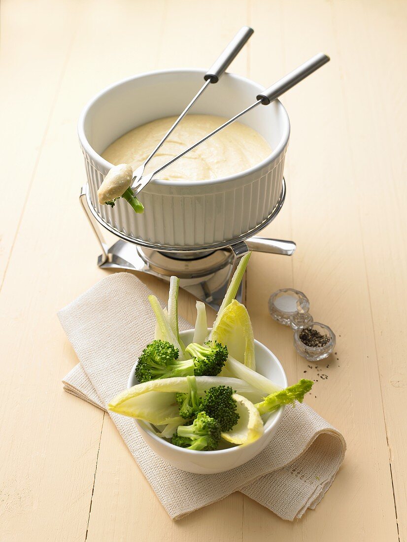 Cheese fondue with broccoli and chicory