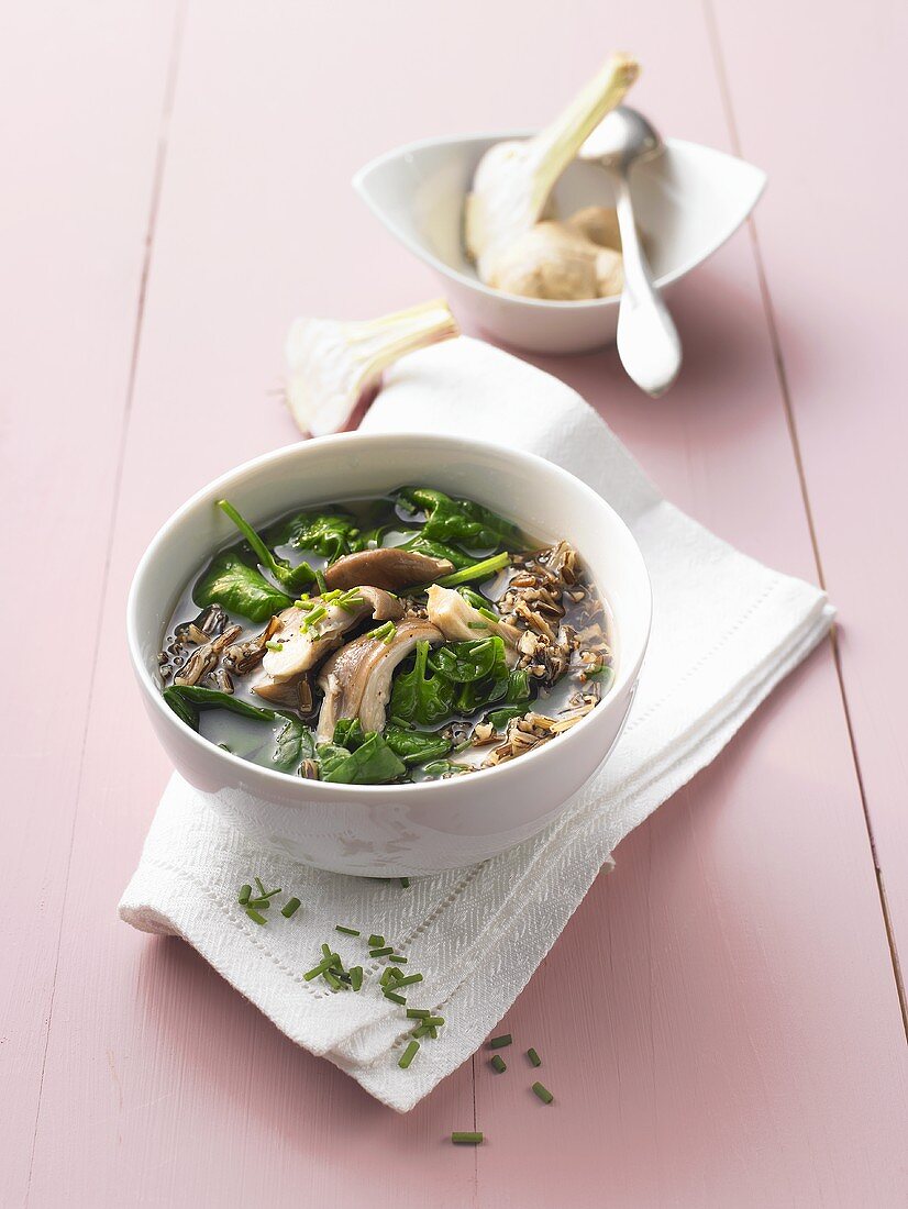 Spinach soup with wild rice and mushrooms