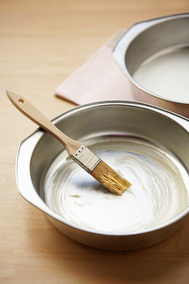 Buttering a baking tin