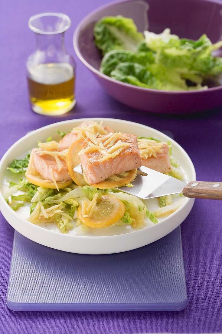 Fried salmon with ginger and lemon and a green salad
