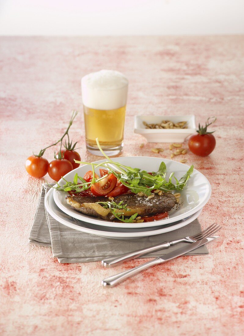 Minute steak with rocket and tomatoes