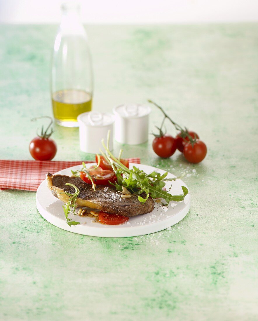 Minute steak with rocket and tomatoes
