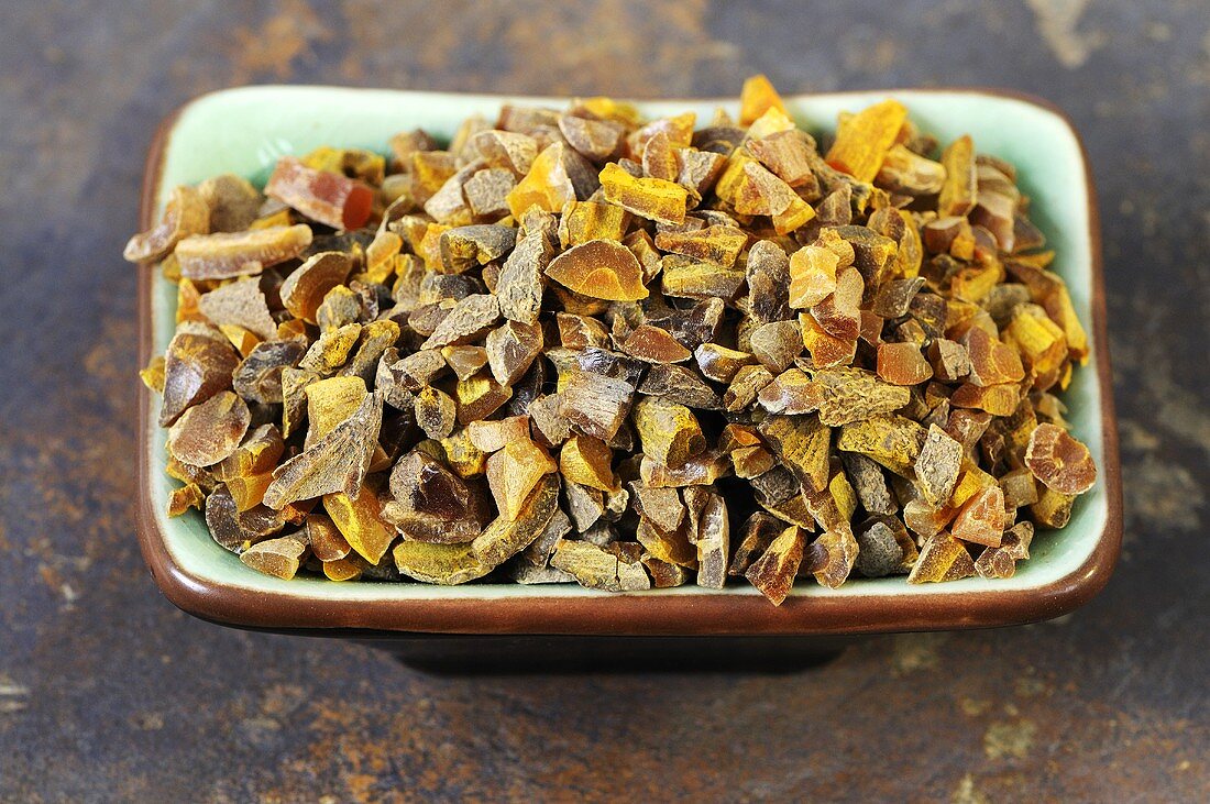Dried turmeric root in a dish