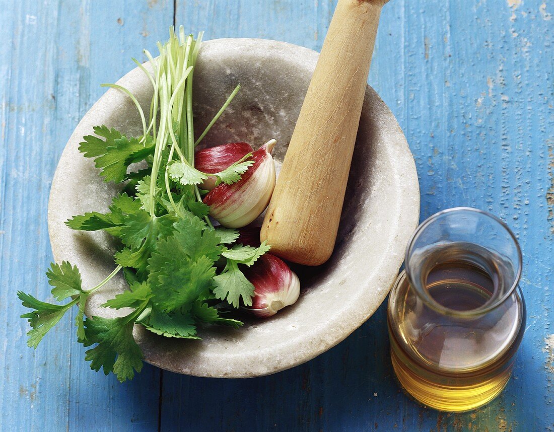 Mortar with parsley, garlic and oil