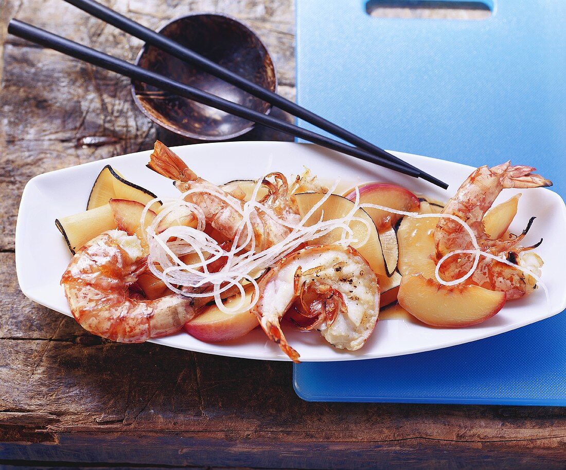Grilled king prawns with peach and radish salad