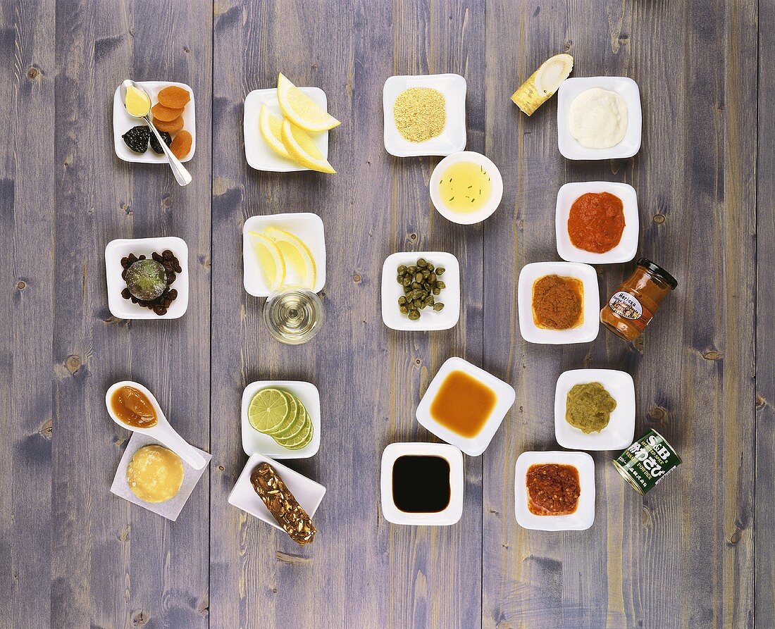 An assortment of spices and spicy sauces in small bowls