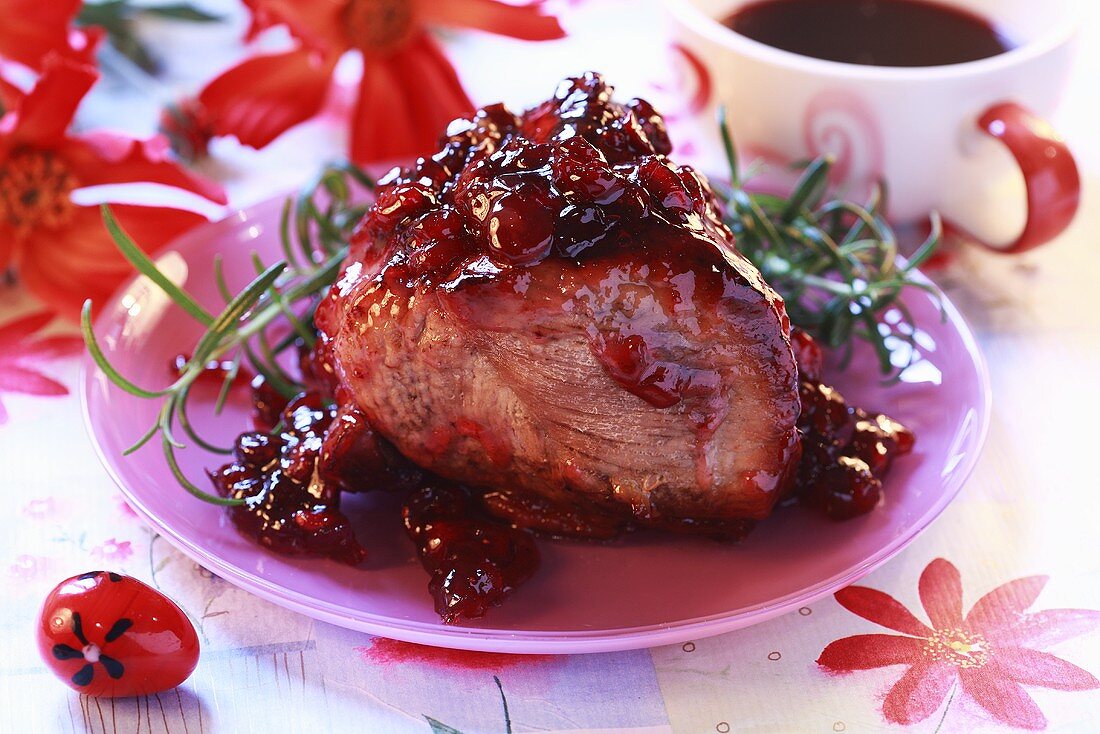 Roast pork glazed with cranberry jam
