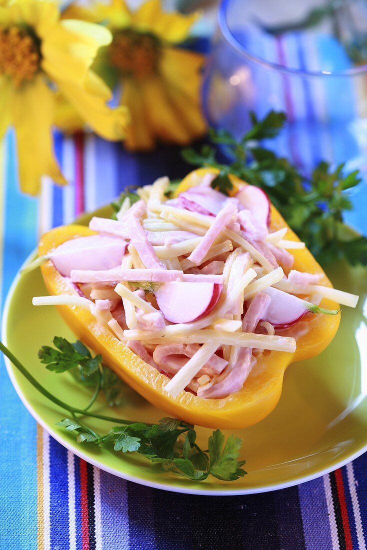 Ham, cheese and radish salad in half a yellow pepper