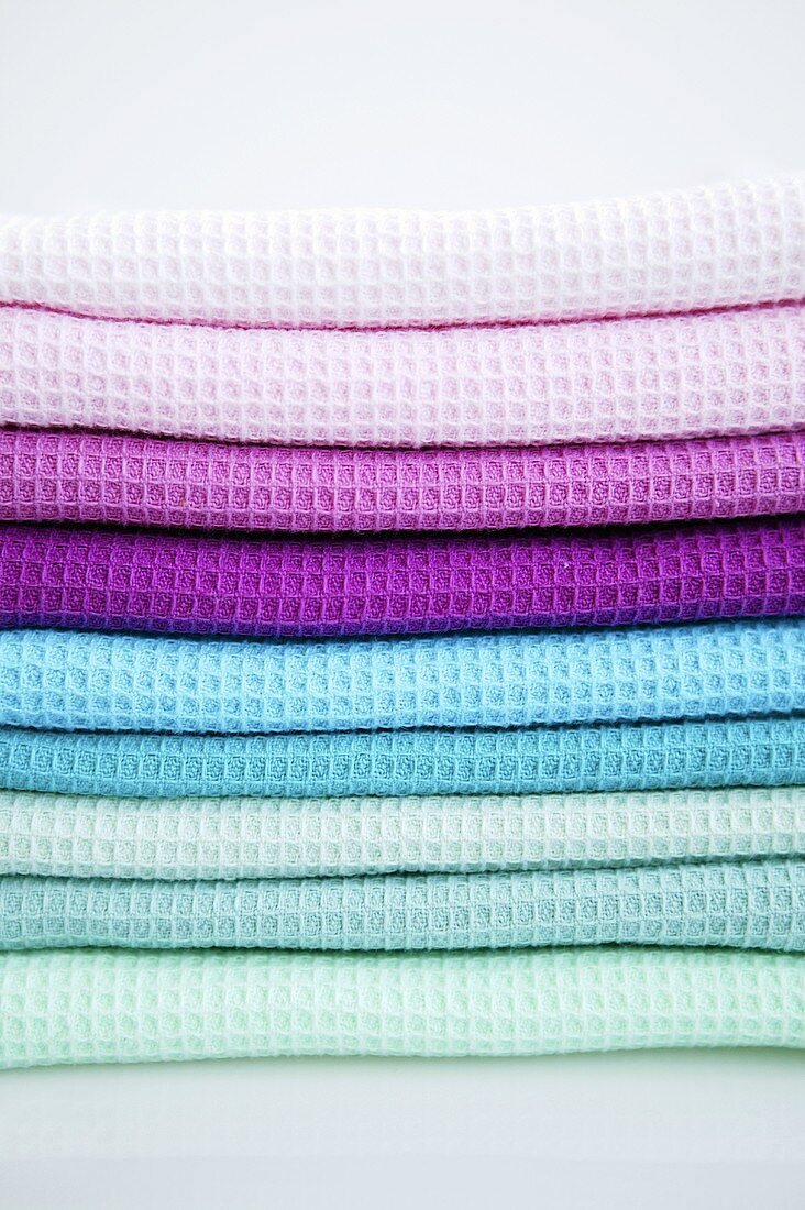 Pile of different-coloured tea towels