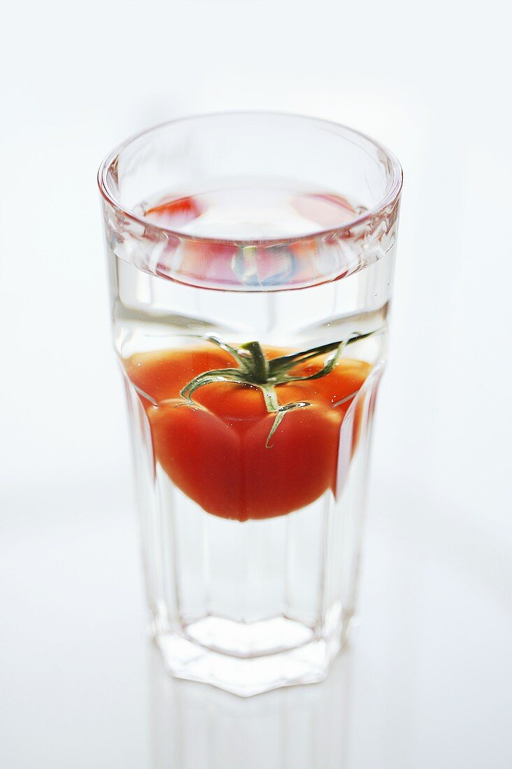 Tomato in a glass of water
