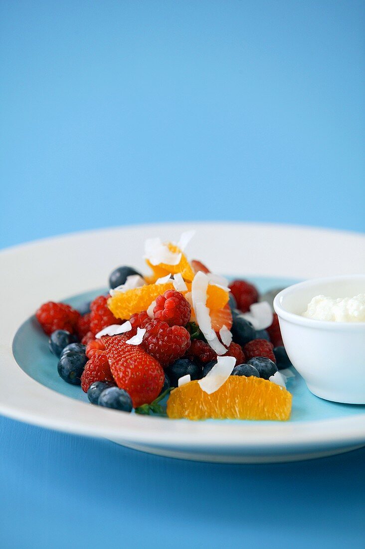 Fruit salad with berries and orange segments