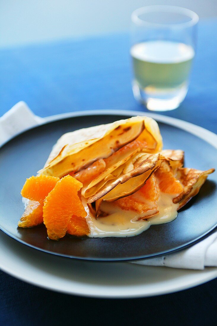 Crèpes with oranges and custard