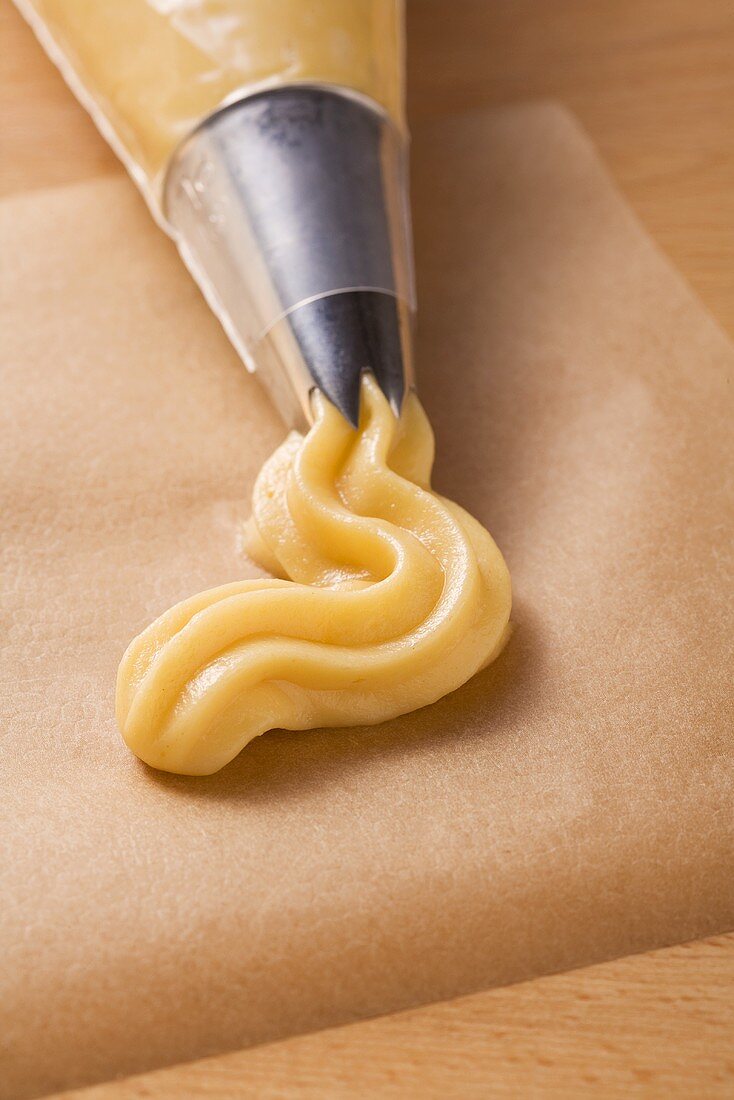 Choux pastry in a piping bag