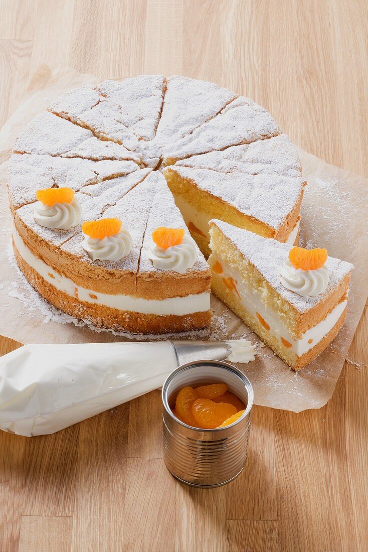 Cream cake with cheese cream filling and mandarin oranges