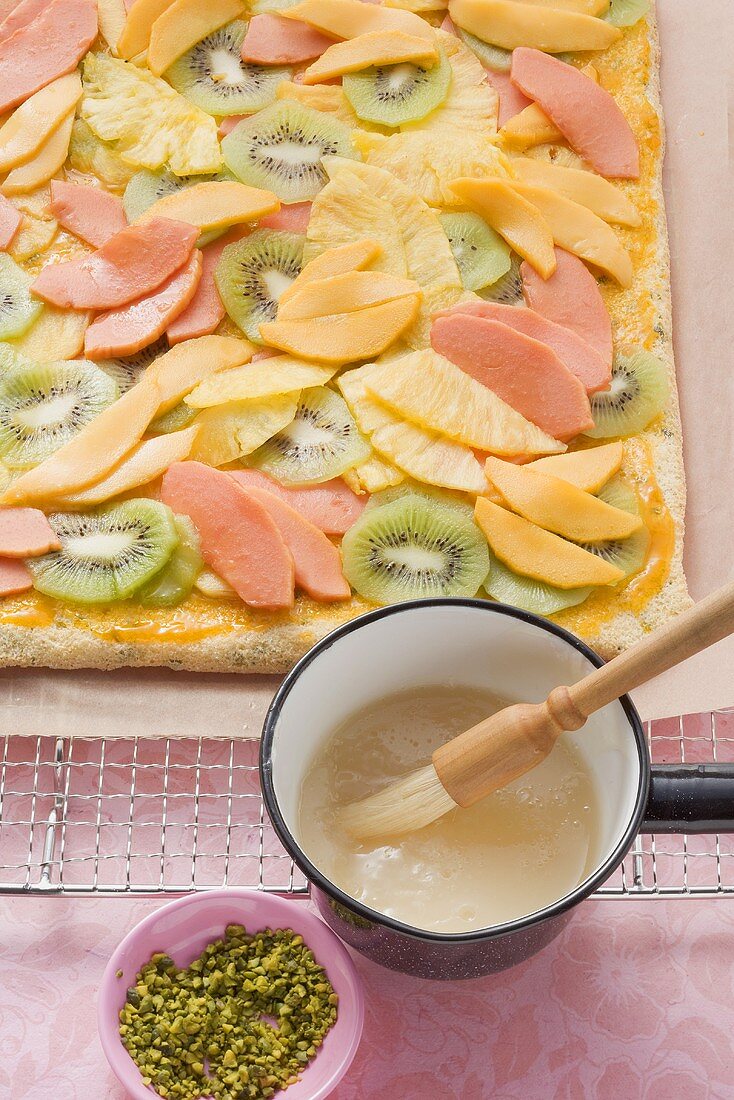 Tray-baked cake topped with exotic fruit