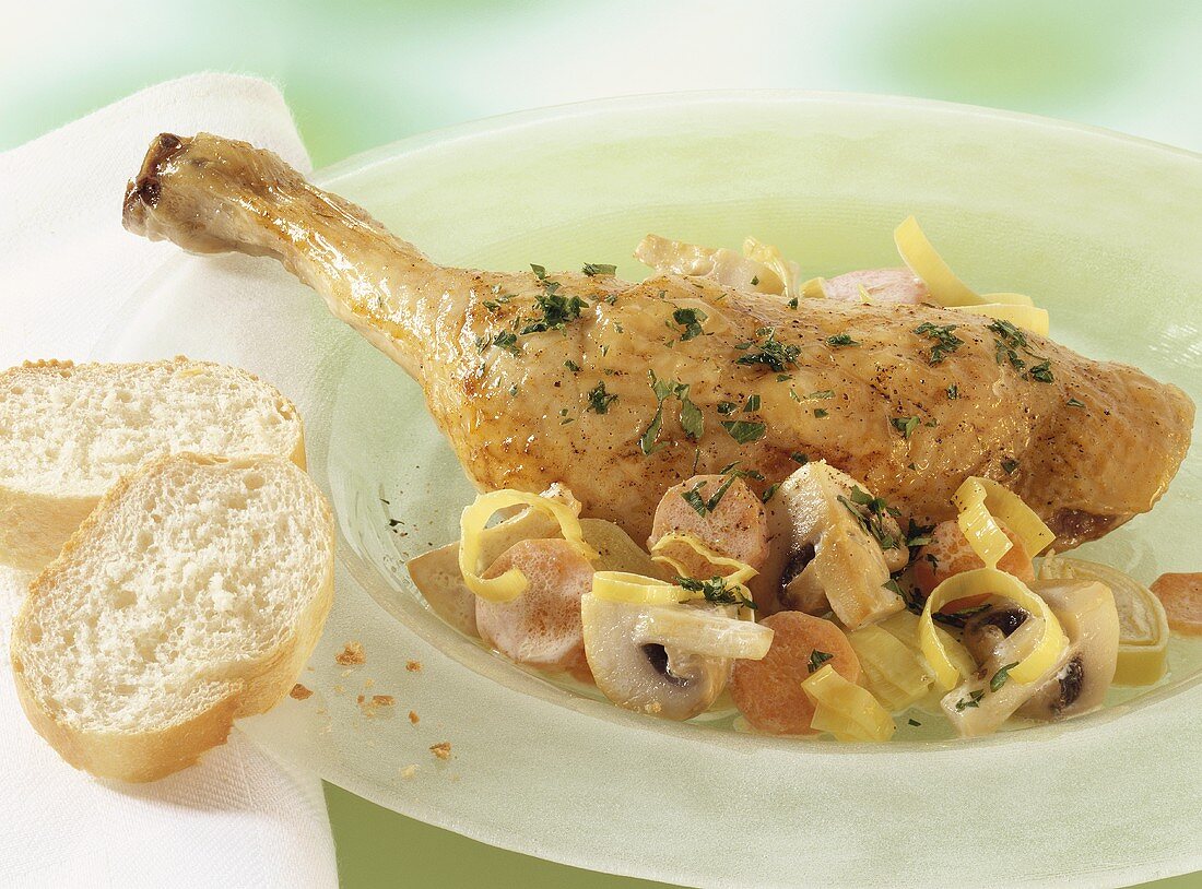 Chicken leg with mushrooms and vegetables, cooked in Römertopf