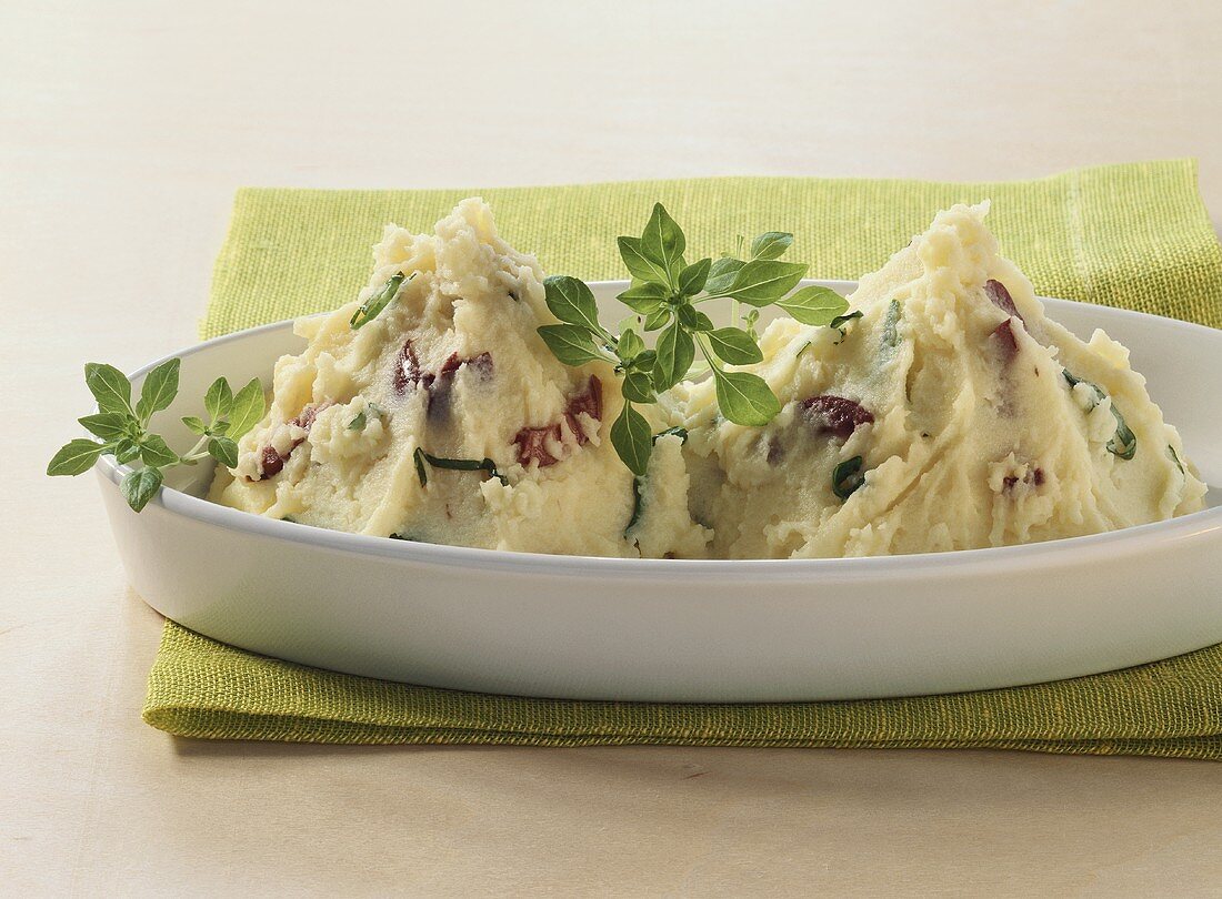 Mashed potato with olives and basil