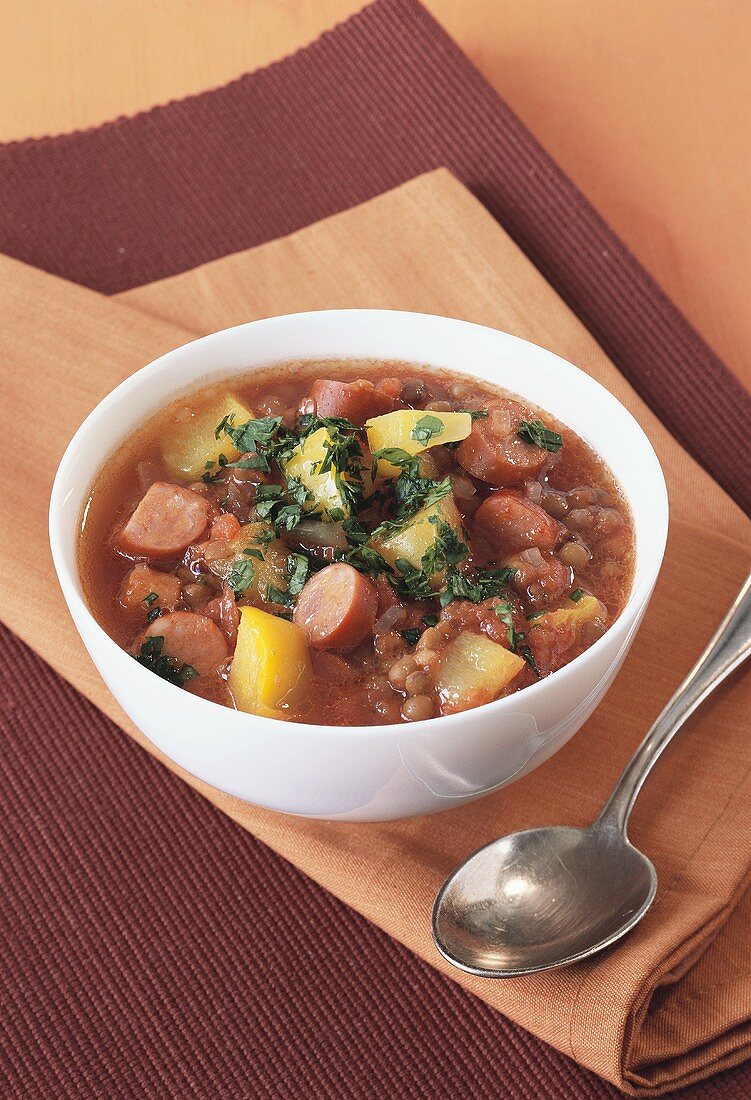 Lentil and tomato stew with sausages