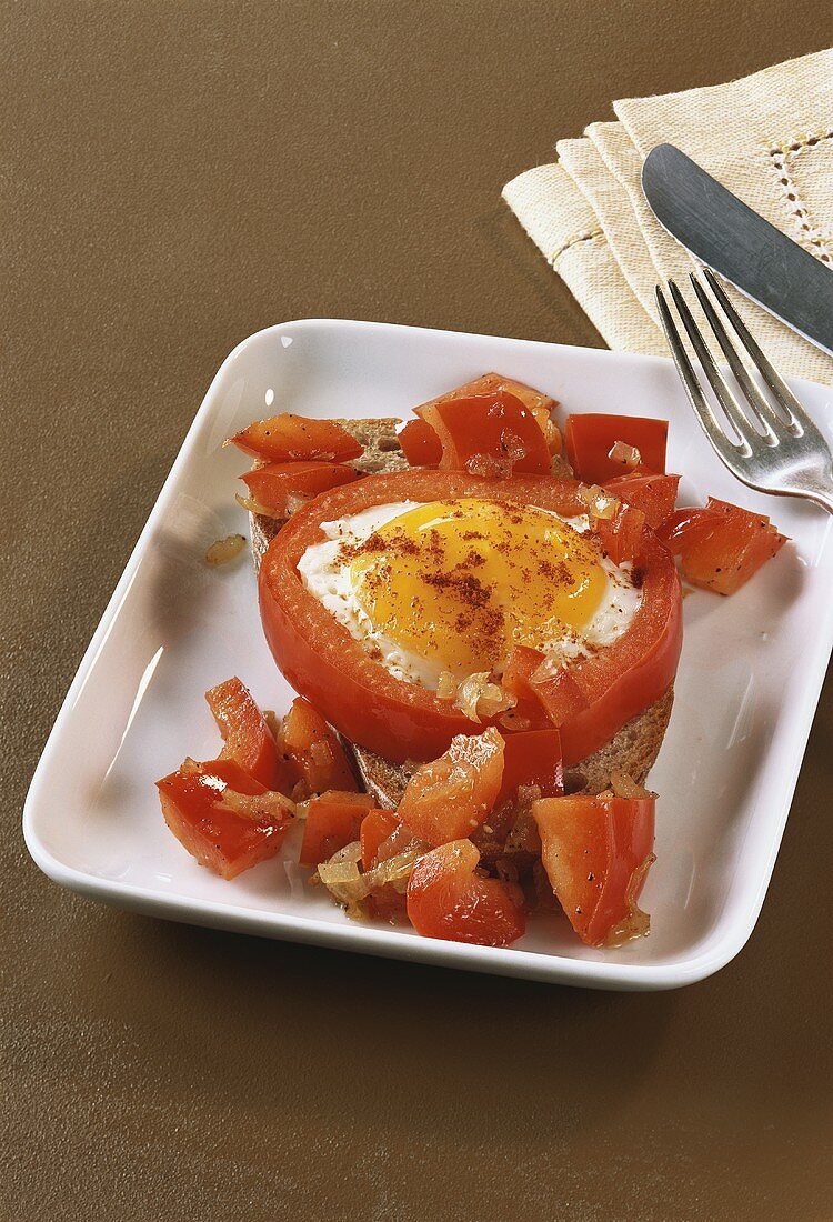 Bread topped with pepper and fried egg