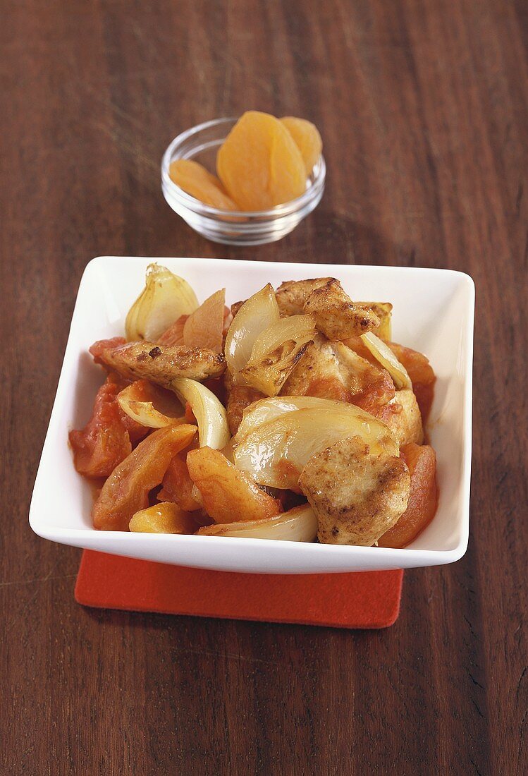 Chicken fillet with apricots and onions
