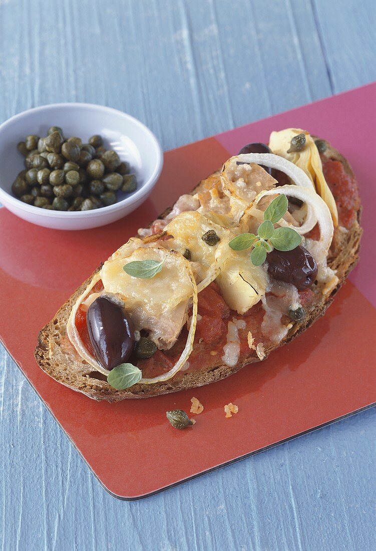 Bread topped with pizza ingredients, browned in oven