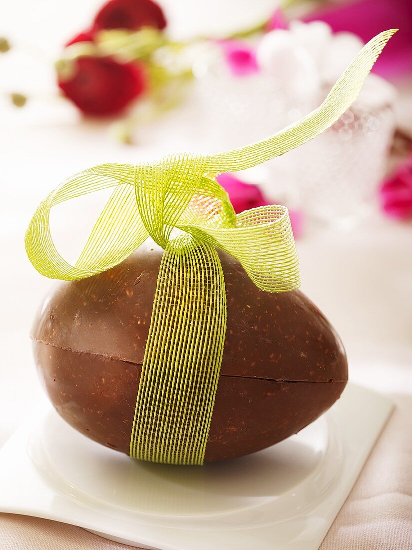 Nut chocolate Easter egg with bow