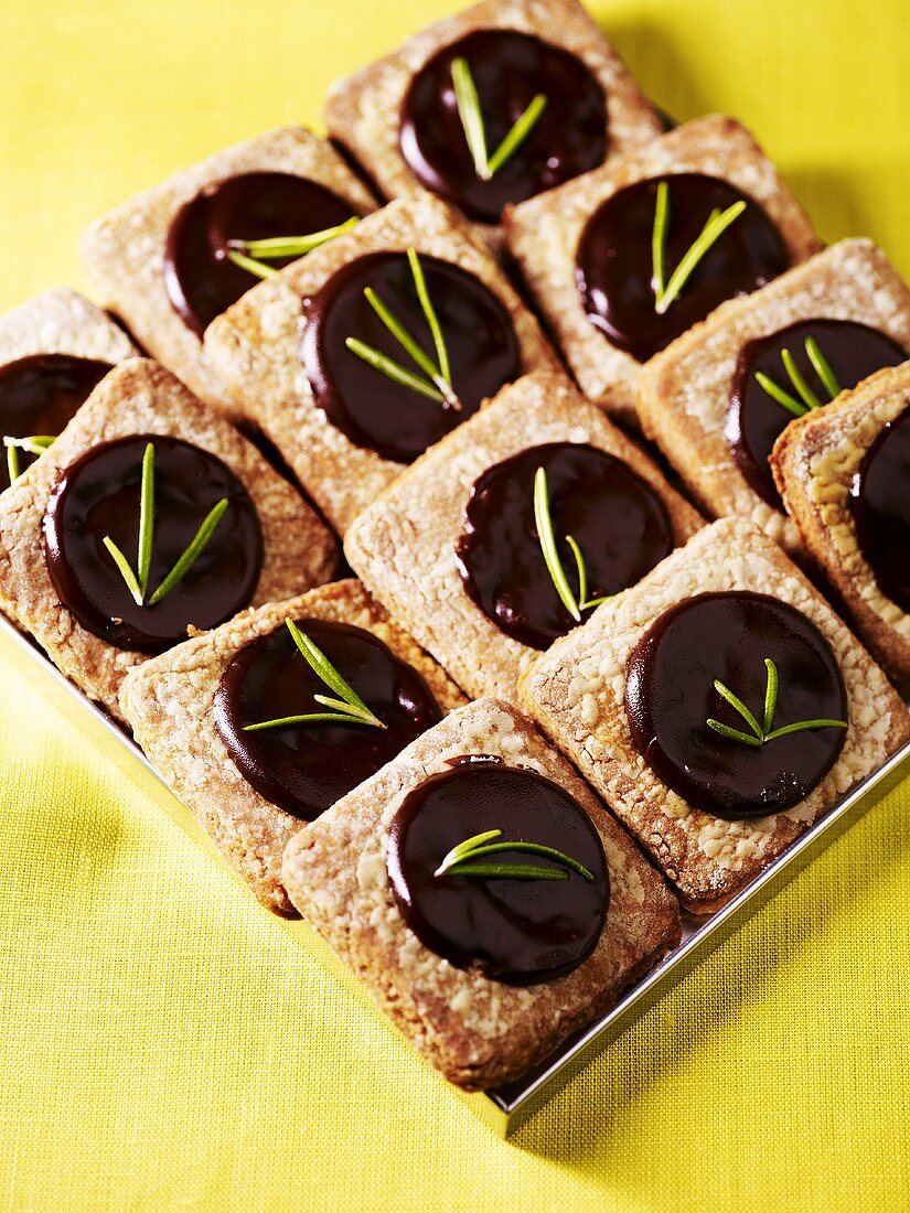 Biscuits with chocolate filling and rosemary