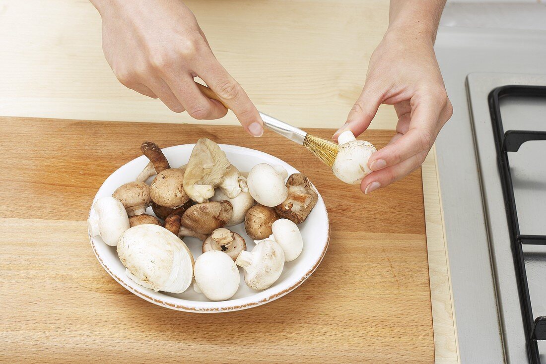 Cleaning mushrooms with a brush