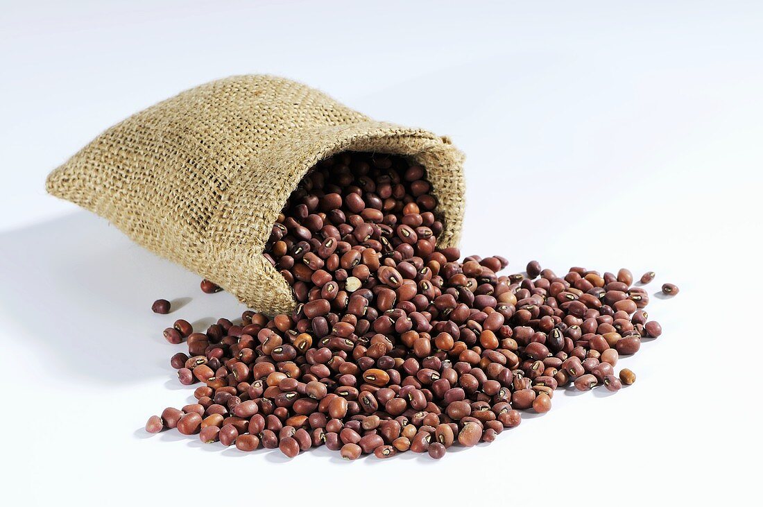 Azuki beans spilling out of hessian sack