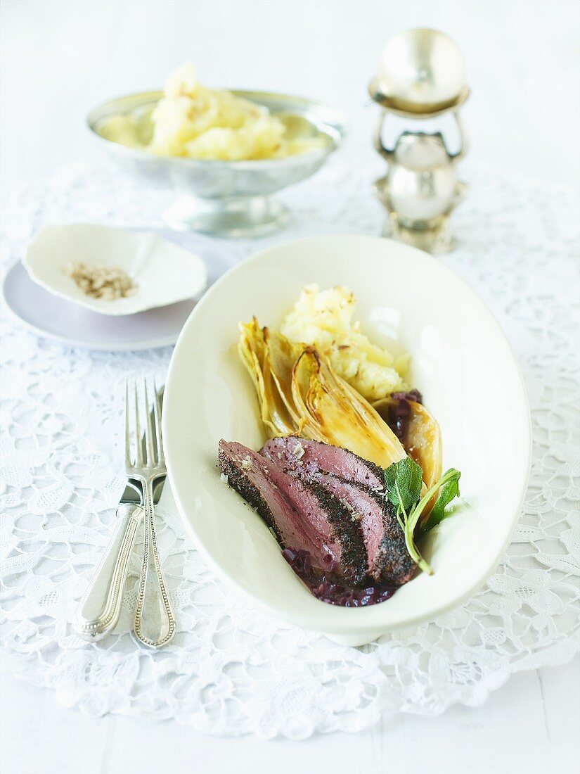 Venison fillet with chicory and elderflower butter