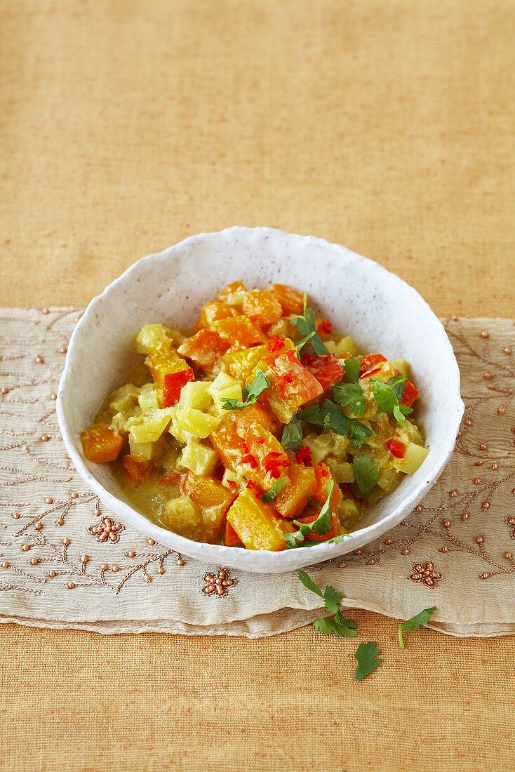 Yellow and red vegetable curry with carrots