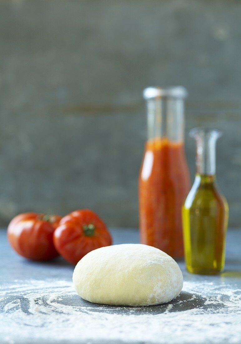Pizza dough, tomatoes, ketchup and olive oil
