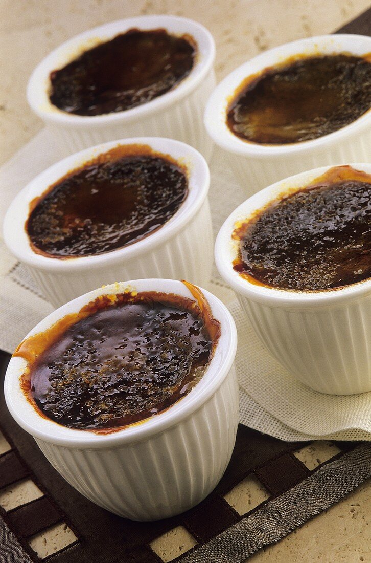 Caramelised chocolate cream in several small pots