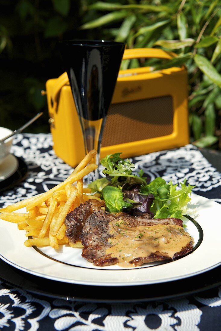 Beefsteak with mustard sauce and chips