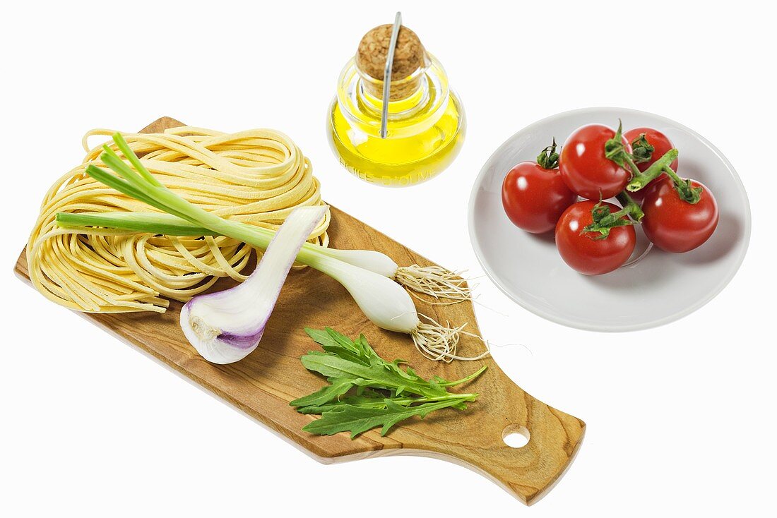 Still life with pasta, vegetables and olive oil