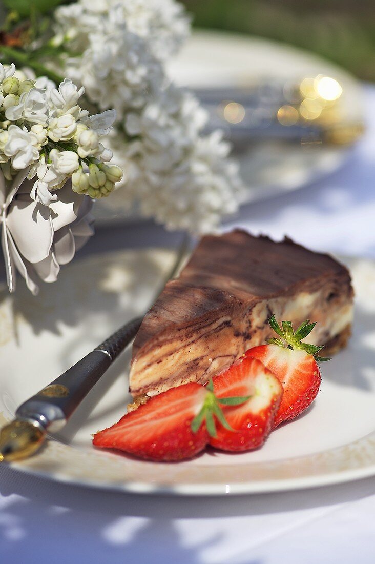 Piece of cheesecake with fresh strawberries