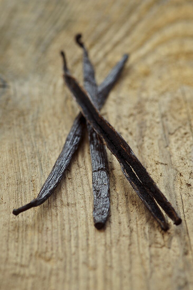 Vanilla pods on wooden background