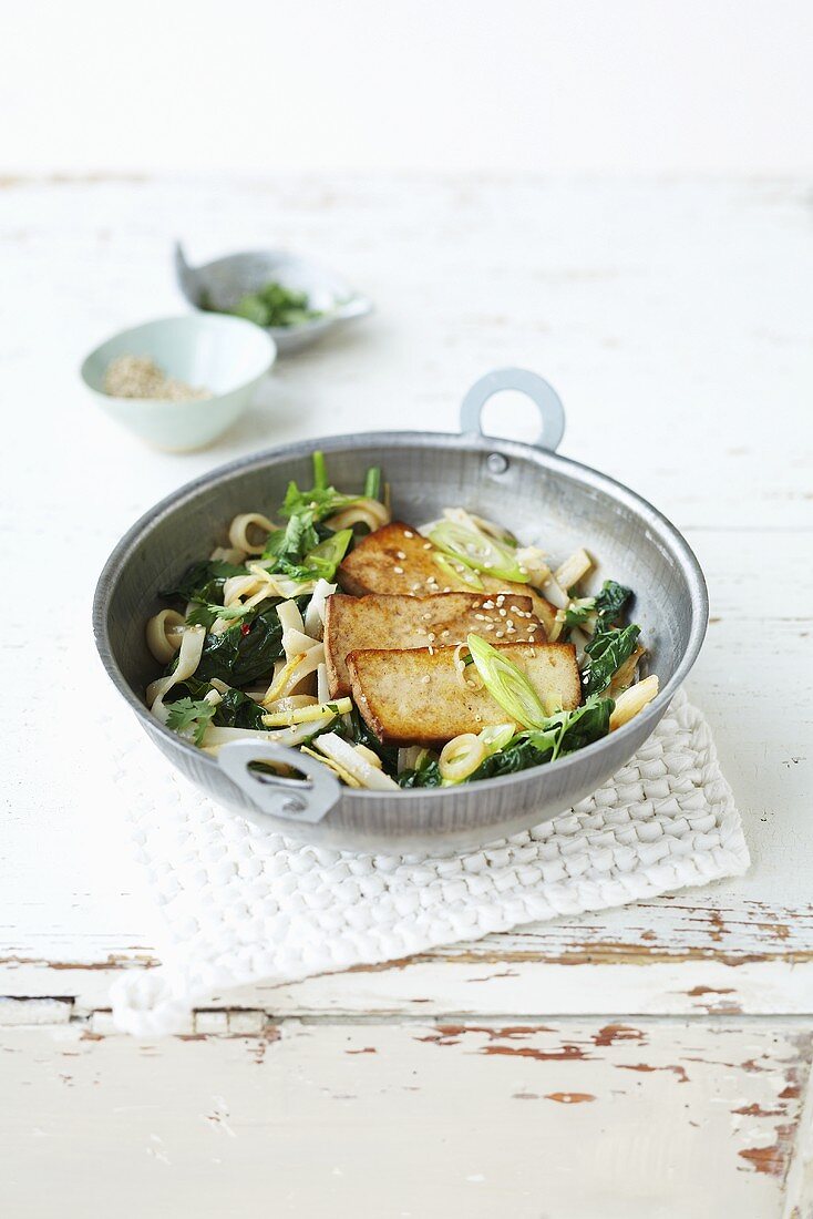 Rice ribbon noodles with tofu and spinach