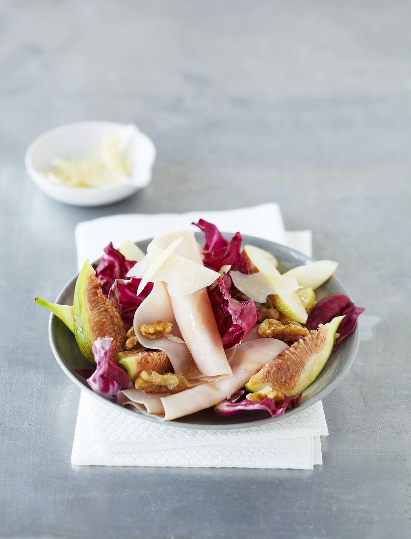 Radicchio, pear and fig salad with sliced turkey breast