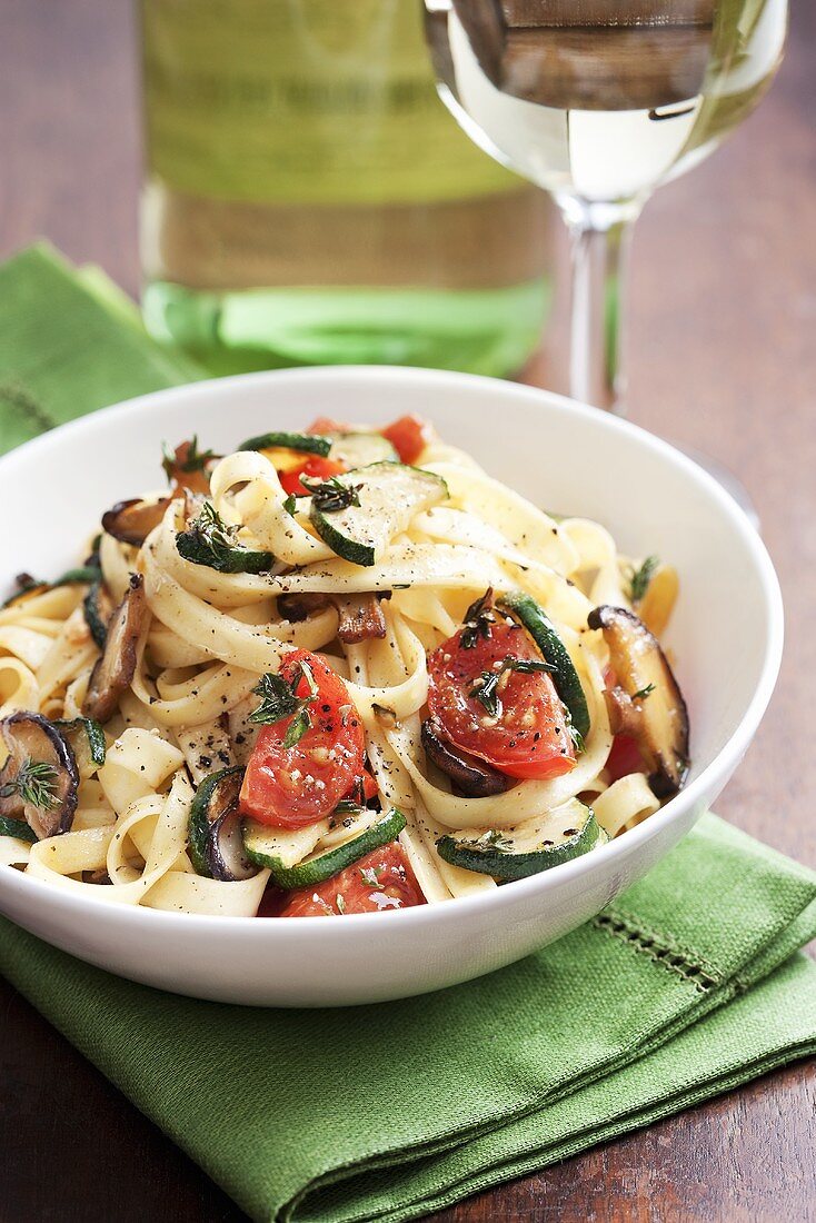 Ribbon pasta with tomatoes, courgettes and mushrooms