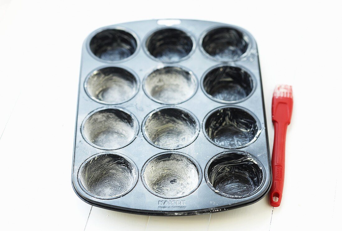 Muffin tin, greased and dusted with flour
