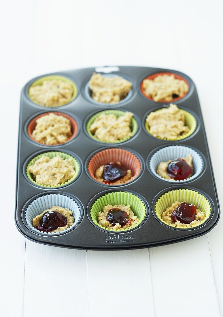 Making Linzer cupcakes (cupcake mixture in a muffin tin)