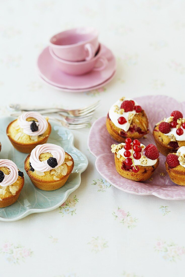 Almond and cherry cupcakes and muesli cupcakes with berries