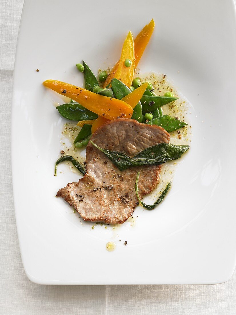Veal escalope with spring vegetables