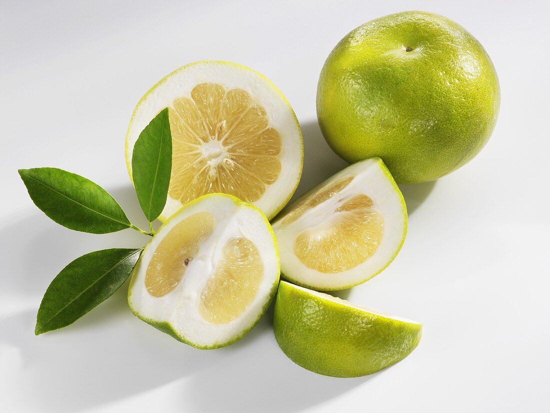Green grapefruits (whole, halved and wedges)