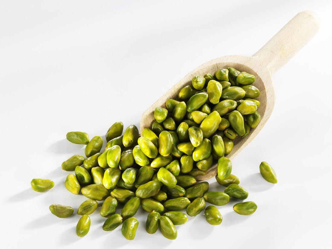 Pistachios in wooden scoop