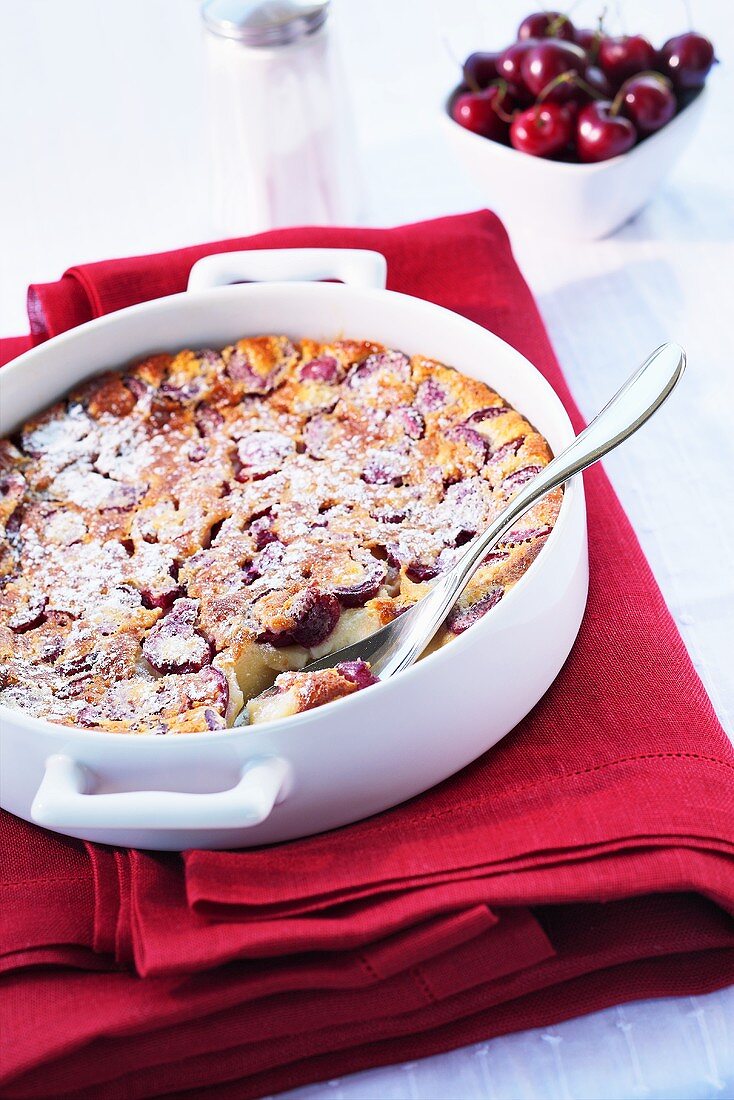 Cherry pudding sprinkled with icing sugar